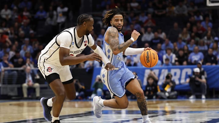 Mar 18, 2025; Dayton, OH, USA; North Carolina Tar Heels guard RJ Davis (4) dribbles the ball defended by San Diego State Aztecs forward Jared Coleman-Jones (31) .