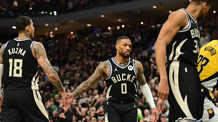 Apr 27, 2025; Milwaukee, Wisconsin, USA; Milwaukee Bucks guard Damian Lillard (0) reacts with forward Kyle Kuzma (18) in the first quarter against the Indiana Pacers during game four of first round for the 2024 NBA Playoffs at Fiserv Forum. Lillard left the game early in the in the first quarter with an injury. Mandatory Credit: Benny Sieu-Imagn Images Apr 27, 2025; Milwaukee, Wisconsin, USA; Milwaukee Bucks guard Damian Lillard (0) reacts with forward Kyle Kuzma (18) in the first quarter against the Indiana Pacers during game four of first round for the 2024 NBA Playoffs at Fiserv Forum. Lillard left the game early in the in the first quarter with an injury. Mandatory Credit: Benny Sieu-Imagn Images