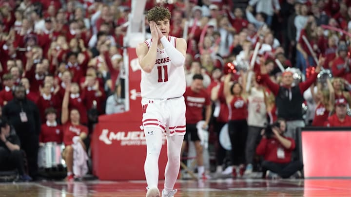 Feb 20, 2024; Madison, Wisconsin, USA;  Wisconsin Badgers guard Max Klesmit (11) celebrates making a "Good Night" pose.