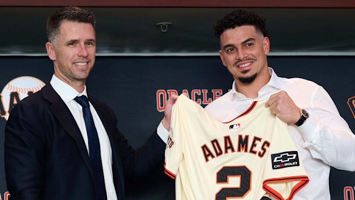 Dec 12, 2024; San Francisco, CA, USA; San Francisco Giants shortstop Willy Adames (2) holds his jersey with president of baseball operations Buster Posey during his introductory press conference at Oracle Park. Dec 12, 2024; San Francisco, CA, USA; San Francisco Giants shortstop Willy Adames (2) holds his jersey with president of baseball operations Buster Posey during his introductory press conference at Oracle Park.