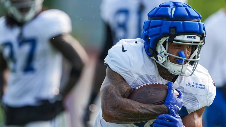 Indianapolis Colts running back Seth McGowan (20) rushes up the field Sunday, Aug. 9, 2026, during Colts Camp practice at Gand Park in Westfield. Indianapolis Colts running back Seth McGowan (20) rushes up the field Sunday, Aug. 9, 2026, during Colts Camp practice at Gand Park in Westfield.