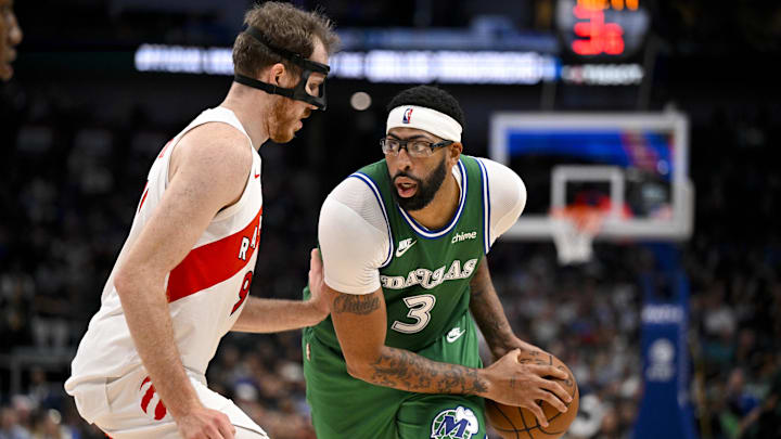 Oct 26, 2025; Dallas, Texas, USA; Dallas Mavericks forward Anthony Davis (3) looks to move the ball past Toronto Raptors center Jakob Poeltl (19) during the game between the Mavericks and the Raptors at the American Airlines Center. Mandatory Credit: Jerome Miron-Imagn Images