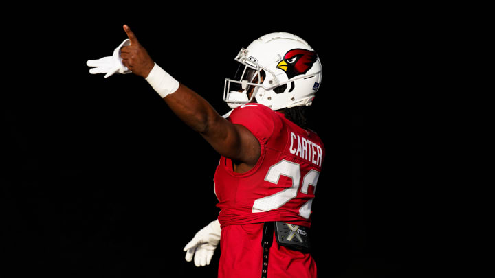 Dec 24, 2023; Chicago, Illinois, USA;  Arizona Cardinals running back Michael Carter (22) warms up before a game against the Chicago Bears at Soldier Field. Mandatory Credit: Jamie Sabau-USA TODAY Sports