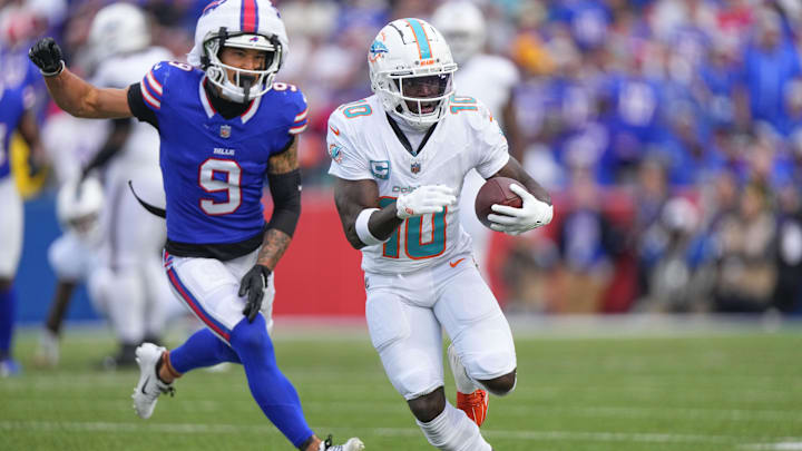 Miami Dolphins wide receiver Tyreek Hill (10) runs with the ball against Buffalo Bills safety Taylor Rapp (9) during the second half at Highmark Stadium. Miami Dolphins wide receiver Tyreek Hill (10) runs with the ball against Buffalo Bills safety Taylor Rapp (9) during the second half at Highmark Stadium.