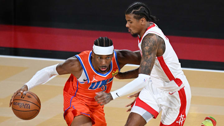 Dec 14, 2024; Las Vegas, Nevada, USA; Oklahoma City Thunder guard Shai Gilgeous-Alexander (2) controls the ball against Houston Rockets guard Jalen Green (4) during the fourth quarter in a semifinal of the 2024 Emirates NBA Cup at T-Mobile Arena. Mandatory Credit: Candice Ward-Imagn Images