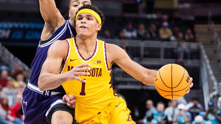 Mar 12, 2025; Indianapolis, IN, USA;  Minnesota Golden Gophers guard Isaac Asuma (1) dribbles the ball while Northwestern Wildcats guard Justin Mullins (20) defends in the second half at Gainbridge Fieldhouse. Mandatory Credit: Trevor Ruszkowski-Imagn Images
