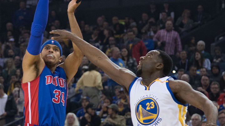 January 12, 2017; Oakland, CA, USA; Detroit Pistons forward Tobias Harris (34) shoots the basketball against Golden State Warriors forward Draymond Green (23) during the first quarter at Oracle Arena. The Warriors defeated the Pistons 127-107. Mandatory Credit: Kyle Terada-Imagn Images
