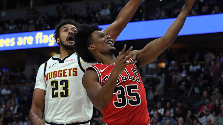 Oct 14, 2025; Denver, Colorado, USA; Chicago Bulls forward Isaac Okoro (35) scores against Denver Nuggets forward Cam Johnson (23) during the first half at Ball Arena. Mandatory Credit: Christopher Hanewinckel-Imagn Images Oct 14, 2025; Denver, Colorado, USA; Chicago Bulls forward Isaac Okoro (35) scores against Denver Nuggets forward Cam Johnson (23) during the first half at Ball Arena. Mandatory Credit: Christopher Hanewinckel-Imagn Images