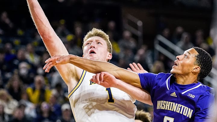 Michigan center Danny Wolf (1) goes to the basket against Washington guard Tyree Ihenacho (6) during the first half at Crisler Center in Ann Arbor on Sunday, Jan. 12, 2025. Michigan center Danny Wolf (1) goes to the basket against Washington guard Tyree Ihenacho (6) during the first half at Crisler Center in Ann Arbor on Sunday, Jan. 12, 2025.