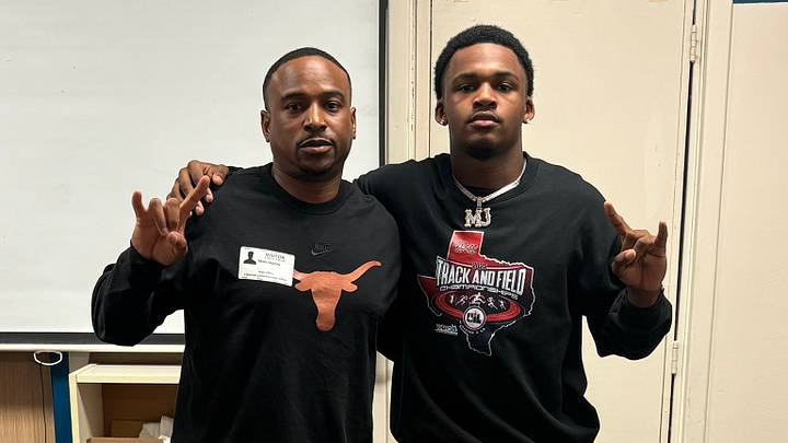 Texas cornerbacks coach Mark Orphey visiting with four-star cornerback Montre Jackson.