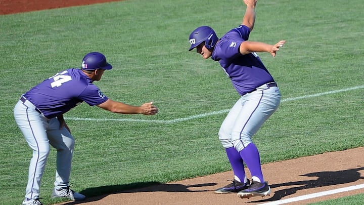Jun 19, 2016; Omaha, NE, USA; TCU Horned Frogs infielder Luken Baker (19) celebrates with assistant coach Bill Mosiello after a ninth inning home run against the Texas Tech Red Raiders in the 2016 College World Series at TD Ameritrade Park. TCU won 5-3. Mandatory Credit: Steven Branscombe-USA TODAY Sports