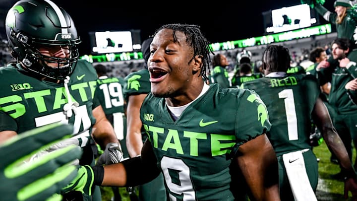 Michigan State's Kenneth Walker III celebrates with teammates after beating Maryland on Saturday, Nov. 13, 2021, at Spartan Stadium in East Lansing.

211113 Msu Maryland 199a