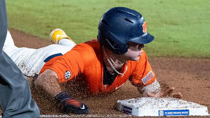 Auburn Tigers' Bristol Carter (5) steals third base as Auburn Tigers take on Arkansas Razorbacks during the SEC baseball tournament at Hoover Metropolitan Stadium in Hoover, Ala. on Saturday, May 23, 2026. Arkansas Razorbacks defeated Arkansas Razorbacks 2-1. Auburn Tigers' Bristol Carter (5) steals third base as Auburn Tigers take on Arkansas Razorbacks during the SEC baseball tournament at Hoover Metropolitan Stadium in Hoover, Ala. on Saturday, May 23, 2026. Arkansas Razorbacks defeated Arkansas Razorbacks 2-1.