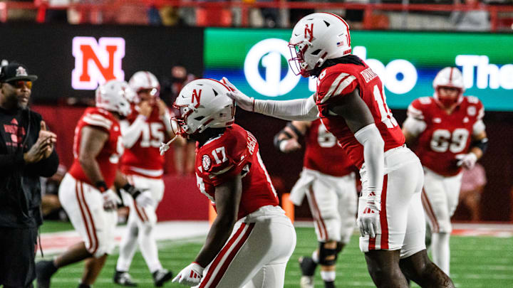 Willis McGahee IV (17) and Princewill Umanmielen celebrate Nebraska’s recovery of a Colorado fumble to secure the win. 
