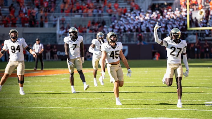 Nick Andersen (45) and the Demon Deacon defense celebrate as they close out a win against Virginia Tech on Saturday, Oct. 4, at Lane Stadium. Nick Andersen (45) and the Demon Deacon defense celebrate as they close out a win against Virginia Tech on Saturday, Oct. 4, at Lane Stadium.