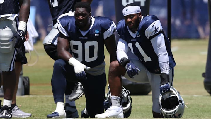 Dallas Cowboys defensive end DeMarcus Lawrence and linebacker Micah Parsons during training camp.