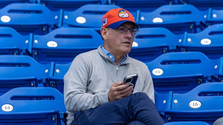 New York Mets owner Steve Cohen sitting in stands during spring training