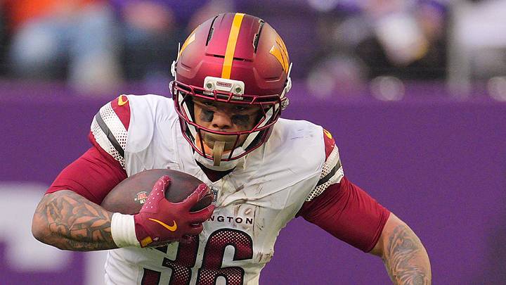 Dec 7, 2025; Minneapolis, Minnesota, USA; Washington Commanders running back Chris Rodriguez Jr. (36) rushes the ball against the Minnesota Vikings during the second half at U.S. Bank Stadium. Dec 7, 2025; Minneapolis, Minnesota, USA; Washington Commanders running back Chris Rodriguez Jr. (36) rushes the ball against the Minnesota Vikings during the second half at U.S. Bank Stadium.