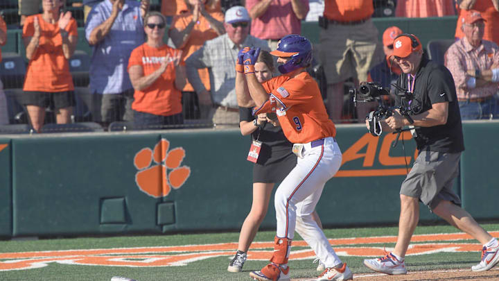 Clemson catcher Jacob Jarrell (9) hits a home run against University of Louisville during the bottom of the fifth inning at Doug Kingsmore Stadum in Clemson, S.C. Friday, April 18, 2025. The home run broke up a no-hitter and helped the Tigers win 2-1. Clemson catcher Jacob Jarrell (9) hits a home run against University of Louisville during the bottom of the fifth inning at Doug Kingsmore Stadum in Clemson, S.C. Friday, April 18, 2025. The home run broke up a no-hitter and helped the Tigers win 2-1.