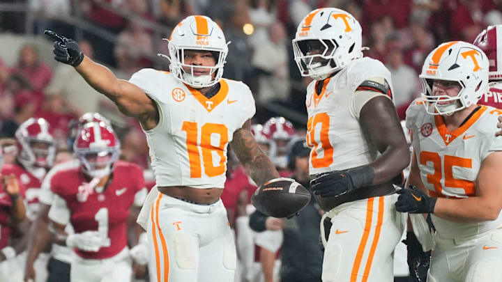 Tennessee running back DeSean Bishop (18) signals the first down during a college football game against Alabama at Bryant-Denny Stadium in Tuscaloosa, Ala., on Oct. 18, 2025.