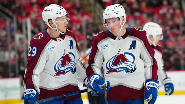 Dec 5, 2024; Raleigh, North Carolina, USA; Colorado Avalanche center Nathan MacKinnon (29) and defenseman Cale Makar (8) look on against the Carolina Hurricanes during the third period at Lenovo Center. Mandatory Credit: James Guillory-Imagn Images Dec 5, 2024; Raleigh, North Carolina, USA; Colorado Avalanche center Nathan MacKinnon (29) and defenseman Cale Makar (8) look on against the Carolina Hurricanes during the third period at Lenovo Center. Mandatory Credit: James Guillory-Imagn Images