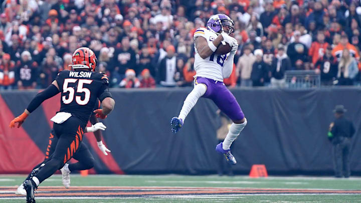 Minnesota Vikings wide receiver Justin Jefferson (18) catches a pass in the fourth quarter of a Week 15 NFL football game between the Minnesota Vikings and the Cincinnati Bengals, Saturday, Dec. 16, 2023, at Paycor Stadium in Cincinnati. The Cincinnati Bengals won 27-24 in overtime.