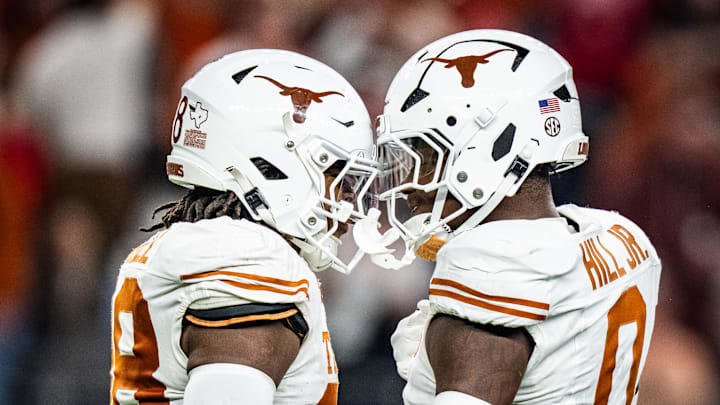 Jan 10, 2025; Arlington, TX, USA; Texas Longhorns linebacker Anthony Hill Jr. (0) celebrates a play with linebacker Barryn Sorrell (88) in the second quarter as the Texas Longhorns play the Ohio State Buckeyes in the Cotton Bowl College Football Playoff semi-final at AT&T Stadium in Dallas, Texas. Mandatory Credit: Sara Diggins/USA TODAY Network via Imagn Images