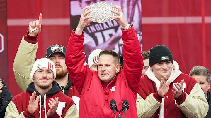Jan 24, 2026; Bloomington, IN, USA; Indiana Hoosiers head coach Curt Cignetti holds up the coaches trophy on Saturday, Jan. 24, 2026, during the Indiana Football College Football Playoff National Championship celebration and parade at Memorial Stadium. Mandatory Credit: Grace Hollars-USA TODAY Network via Imagn Images