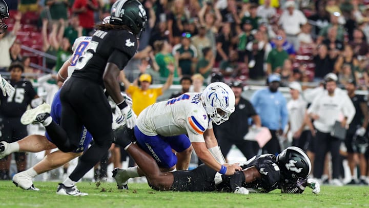 USF defensive back Ira Singleton (10) recovers a fumble from Boise State quarterback Maddux Madsen. It was one of three fumble recoveries for the Bulls.