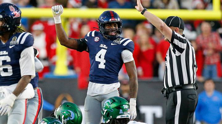 Dec 20, 2025; Oxford, MS, USA; Rebels linebacker Suntarine Perkins (4) reacts after a turnover during the third quarter against the Tulane Green Wave at Vaught-Hemingway Stadium. Mandatory Credit: Petre Thomas-Imagn Images Dec 20, 2025; Oxford, MS, USA; Rebels linebacker Suntarine Perkins (4) reacts after a turnover during the third quarter against the Tulane Green Wave at Vaught-Hemingway Stadium. Mandatory Credit: Petre Thomas-Imagn Images