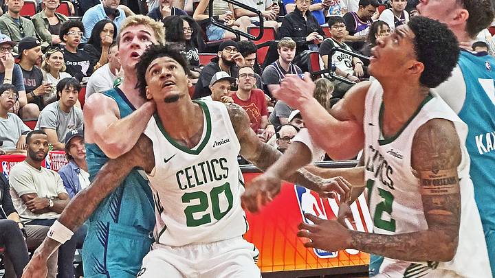 Las Vegas, NV - Dillon Mitchell and Chris Cenac Jr. box out for a rebound against the Charlotte Hornets in the Boston Celtics summer league game on July 12, 2026 Las Vegas, NV - Dillon Mitchell and Chris Cenac Jr. box out for a rebound against the Charlotte Hornets in the Boston Celtics summer league game on July 12, 2026