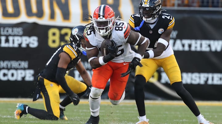 Dec 8, 2024; Pittsburgh, Pennsylvania, USA;  Cleveland Browns tight end David Njoku (85) runs after a catch against Pittsburgh Steelers cornerback Joey Porter Jr. (24) during the fourth quarter at Acrisure Stadium. Mandatory Credit: Charles LeClaire-Imagn Images