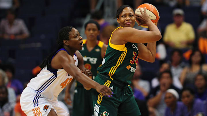 Sep 17, 2011; Phoenix, AZ, USA; Seattle Storm forward Le'coe Willingham (34) is guarded by the Phoenix Mercury forward Nakia Sanford (43) during the first half at the US Airways Center.  The Mercury defeated the Storm 92 - 83. Mandatory Credit: Jennifer Stewart-Imagn Images