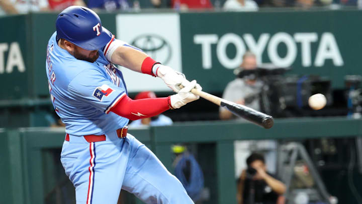 Jun 1, 2025; Arlington, Texas, USA; Texas Rangers designated hitter Jake Burger (21) hits an rbi double during the eighth inning against the St. Louis Cardinals at Globe Life Field. Jun 1, 2025; Arlington, Texas, USA; Texas Rangers designated hitter Jake Burger (21) hits an rbi double during the eighth inning against the St. Louis Cardinals at Globe Life Field.