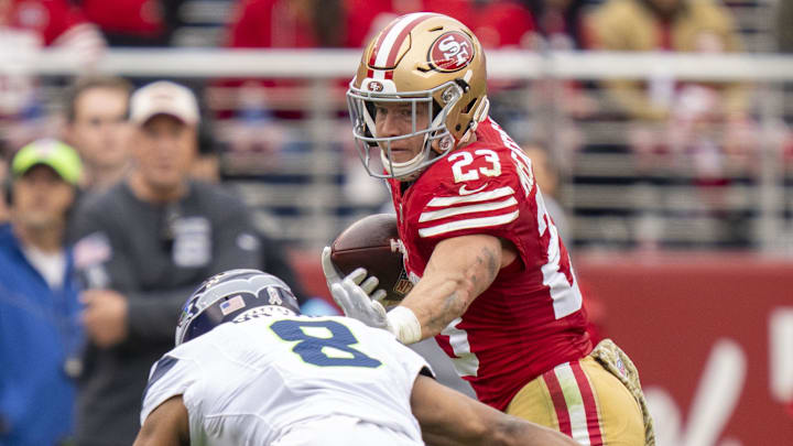 November 17, 2024; Santa Clara, California, USA; San Francisco 49ers running back Christian McCaffrey (23) runs against Seattle Seahawks cornerback Coby Bryant (8) during the second quarter at Levi's Stadium. Mandatory Credit: Kyle Terada-Imagn Images November 17, 2024; Santa Clara, California, USA; San Francisco 49ers running back Christian McCaffrey (23) runs against Seattle Seahawks cornerback Coby Bryant (8) during the second quarter at Levi's Stadium. Mandatory Credit: Kyle Terada-Imagn Images
