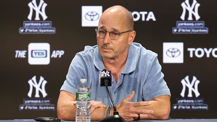 Aug 23, 2023; Bronx, New York, USA; New York Yankees general manager Brian Cashman talks with the media before the game between the Yankees and the Washington Nationals at Yankee Stadium. Mandatory Credit: Vincent Carchietta-Imagn Images