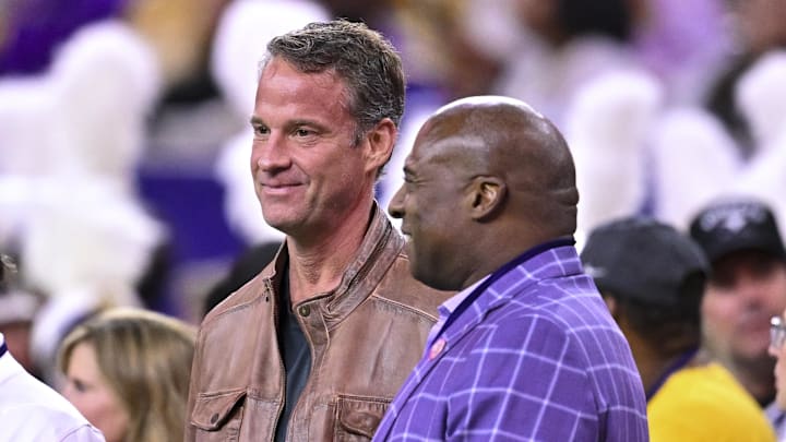 Dec 27, 2025; Houston, TX, USA; Louisiana State Tigers head coach Lane Kiffin, left, stands next to Louisiana State Tigers athletic director Verge Ausberry, right, prior to the game against the Houston Cougars at NRG Stadium. Mandatory Credit: Maria Lysaker-Imagn Images 