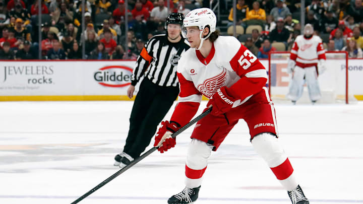 Apr 11, 2024; Pittsburgh, Pennsylvania, USA;  Detroit Red Wings defenseman Moritz Seider (53) skates with the puck against the Pittsburgh Penguins during the second period at PPG Paints Arena. Mandatory Credit: Charles LeClaire-Imagn Images