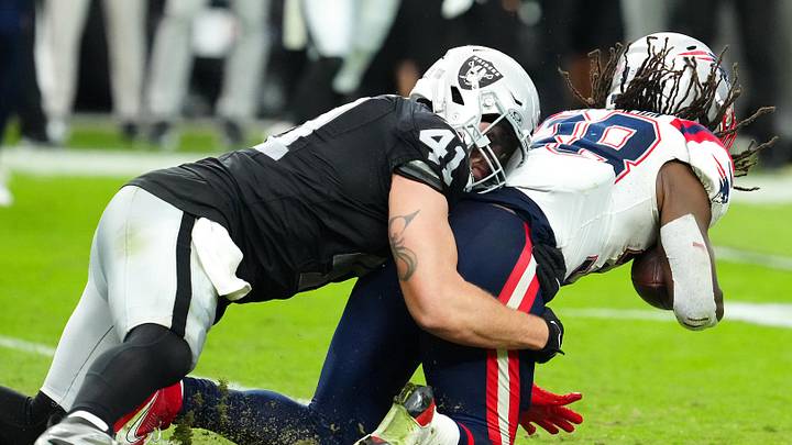 Oct 15, 2023; Paradise, Nevada, USA; Las Vegas Raiders linebacker Robert Spillane (41) tackles New England Patriots wide receiver Matthew Slater (18) during the fourth quarter at Allegiant Stadium. Mandatory Credit: Stephen R. Sylvanie-USA TODAY Sports
