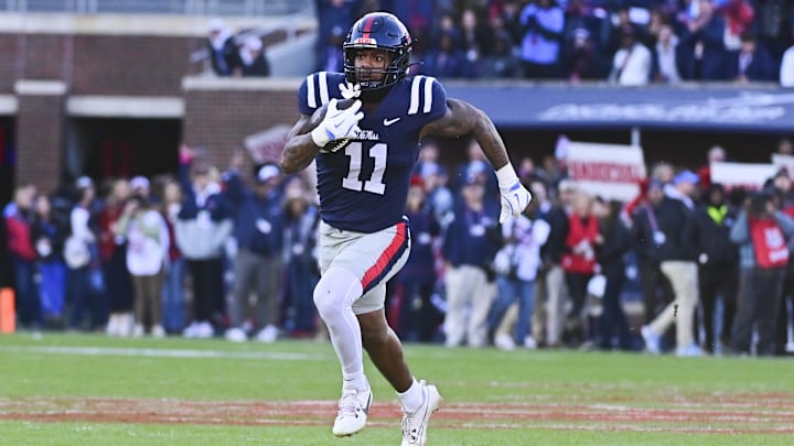 Nov 29, 2024; Oxford, Mississippi, USA;  Mississippi Rebels linebacker Chris Paul Jr. (11) runs the ball after an interception against the Mississippi State Bulldogs during the first quarter at Vaught-Hemingway Stadium. Mandatory Credit: Matt Bush-Imagn Images
