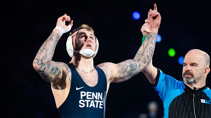 Penn State Nittany Lions wrestler Rocco Welsh gets his hand raised after defeating Nebraska's Silas Allred in the 184-pound bout during a Big Ten dual meet.