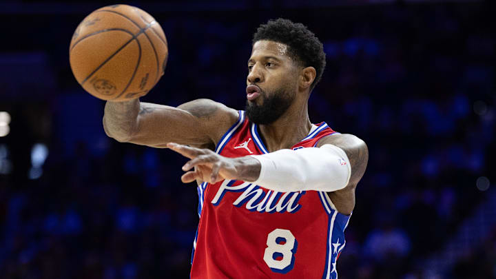 Jan 24, 2025; Philadelphia, Pennsylvania, USA; Philadelphia 76ers forward Paul George (8) passes the ball against the Cleveland Cavaliers during the second quarter at Wells Fargo Center. Mandatory Credit: Bill Streicher-Imagn Images