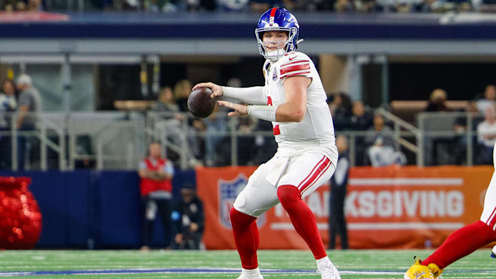 Nov 28, 2024; Arlington, Texas, USA; New York Giants quarterback Drew Lock (2) drops back to pass during the fourth quarter against the Dallas Cowboys at AT& T Stadium.  