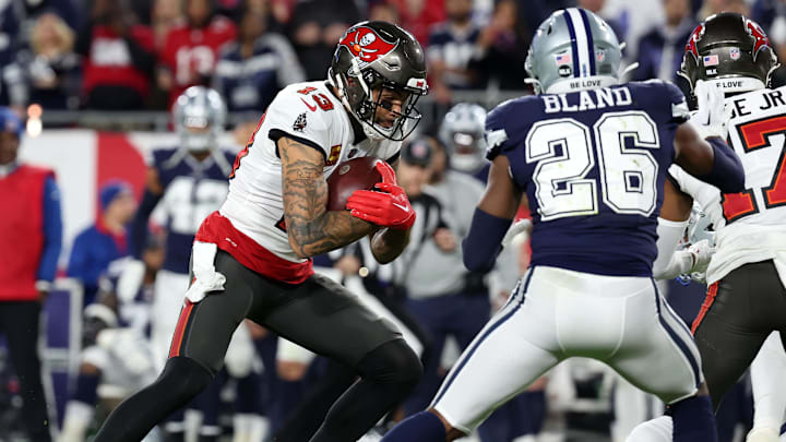 Jan 16, 2023; Tampa, Florida, USA; Tampa Bay Buccaneers wide receiver Mike Evans (13) makes a catch against Dallas Cowboys cornerback DaRon Bland (26) in the first half during the wild card game at Raymond James Stadium. Mandatory Credit: Kim Klement-Imagn Images Jan 16, 2023; Tampa, Florida, USA; Tampa Bay Buccaneers wide receiver Mike Evans (13) makes a catch against Dallas Cowboys cornerback DaRon Bland (26) in the first half during the wild card game at Raymond James Stadium. Mandatory Credit: Kim Klement-Imagn Images