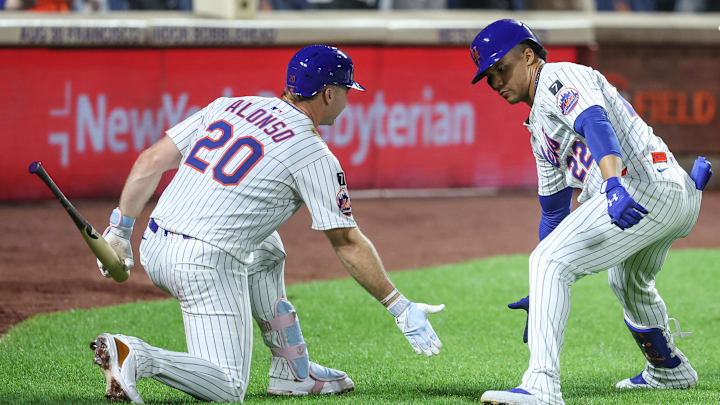 New York Mets right fielder Juan Soto (22) is greeted by first baseman Pete Alonso (20) on August 13, 2025 New York Mets right fielder Juan Soto (22) is greeted by first baseman Pete Alonso (20) on August 13, 2025