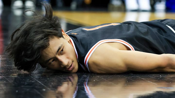 Dec 21, 2024; Newark, New Jersey, USA; Princeton Tigers guard Xaivian Lee (1) falls to the floor during the second half against Rutgers Scarlet Knights at Prudential Center. Mandatory Credit: Tom Horak-Imagn Images