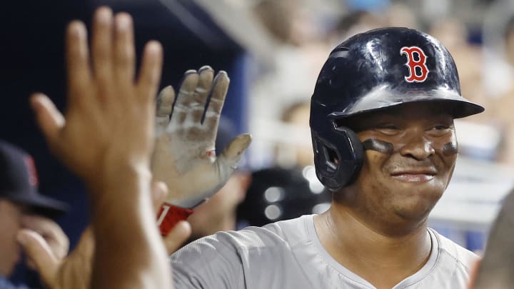 Jul 2, 2024; Miami, Florida, USA;  Boston Red Sox third baseman Rafael Devers (11) celebrates scoring against the Miami Marlins in the seventh inning at loanDepot Park.