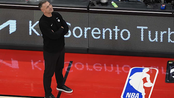 Nov 24, 2025; Toronto, Ontario, CAN; Toronto Raptors head coach Darko Rajakovic smiles as he looks up at the scoreboard during the second half against the Cleveland Cavaliers at Scotiabank Arena. Mandatory Credit: John E. Sokolowski-Imagn Images Nov 24, 2025; Toronto, Ontario, CAN; Toronto Raptors head coach Darko Rajakovic smiles as he looks up at the scoreboard during the second half against the Cleveland Cavaliers at Scotiabank Arena. Mandatory Credit: John E. Sokolowski-Imagn Images