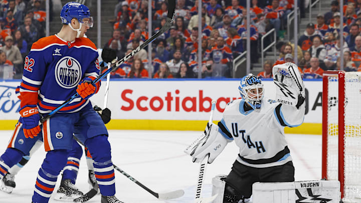 Mar 18, 2025; Edmonton, Alberta, CAN; Edmonton Oilers forward Vasily Podkolzin (92) watches a shot go wide of Utah Hockey Club goaltender Karel Vejmelka (70) during the third period at Rogers Place. Mandatory Credit: Perry Nelson-Imagn Images
