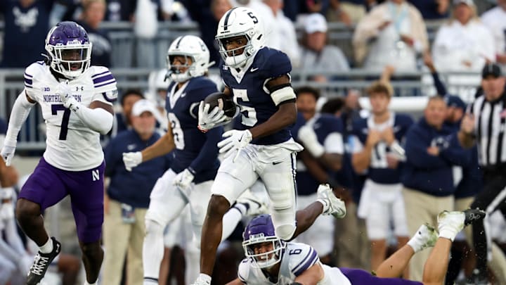 Penn State football wide receiver Devonte Ross (5) runs with the ball after breaking a tackle during the fourth quarter against the Northwestern Wildcats